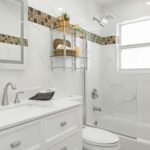 Contemporary bathroom with clean design, marble tiles, and sleek fixtures.